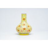 A Chinese famille rose bottle vase with bats, peaches and Shou symbols on a yellow ground, Guangxu m