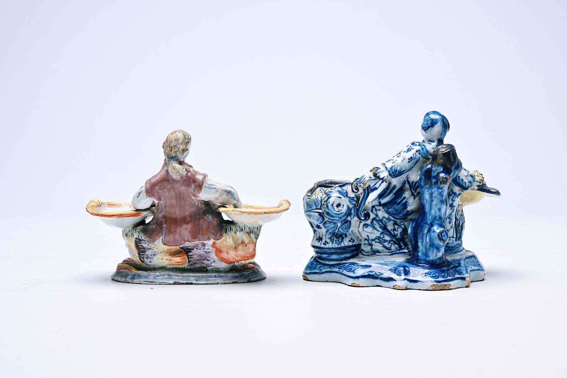 Two Dutch Delft blue and white and polychrome salts in the form of a man and a woman, 18th/19th C. - Image 2 of 6