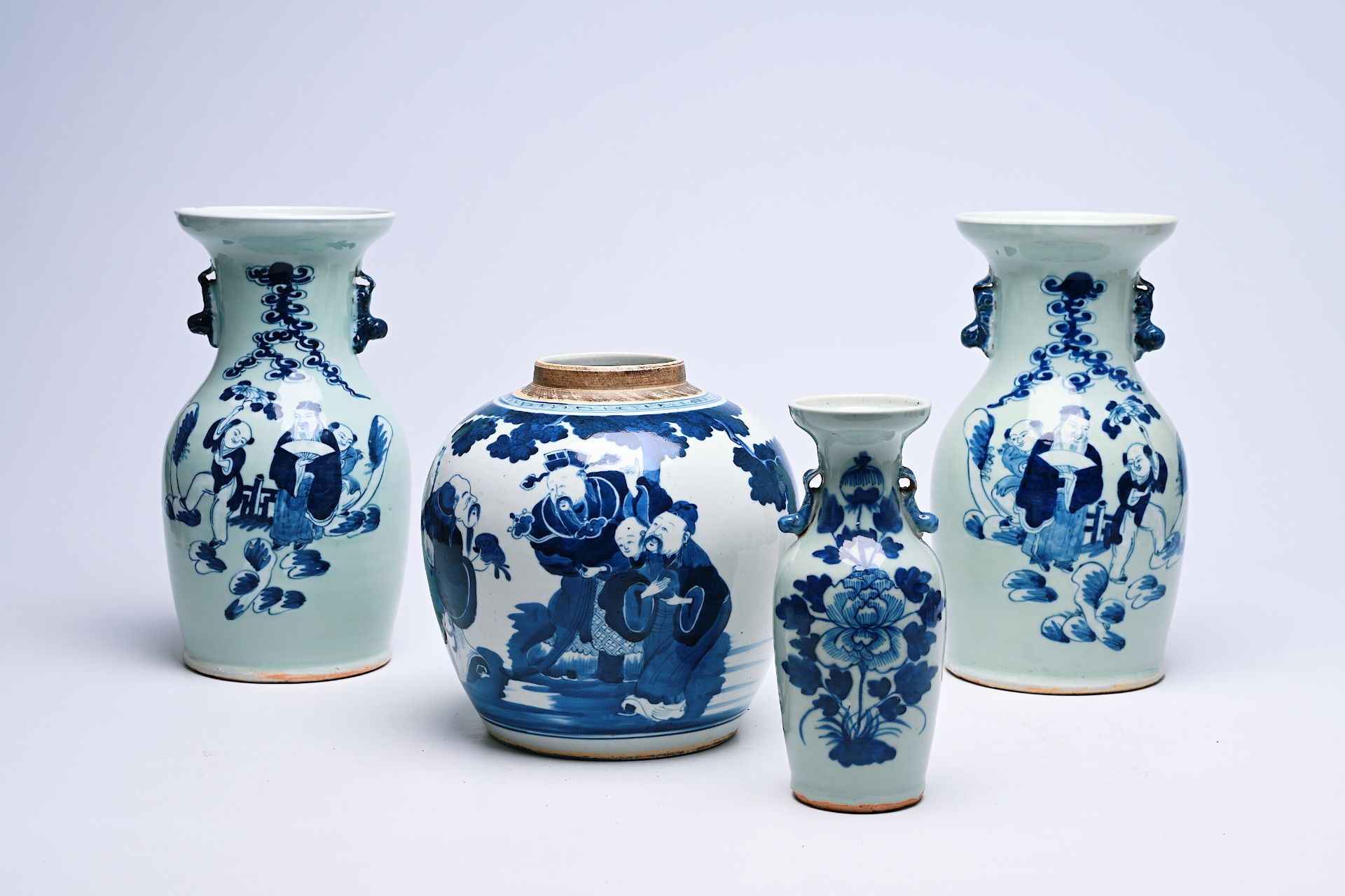 Three Chinese blue and white celadon-ground vases and a blue and white jar, 19th C.