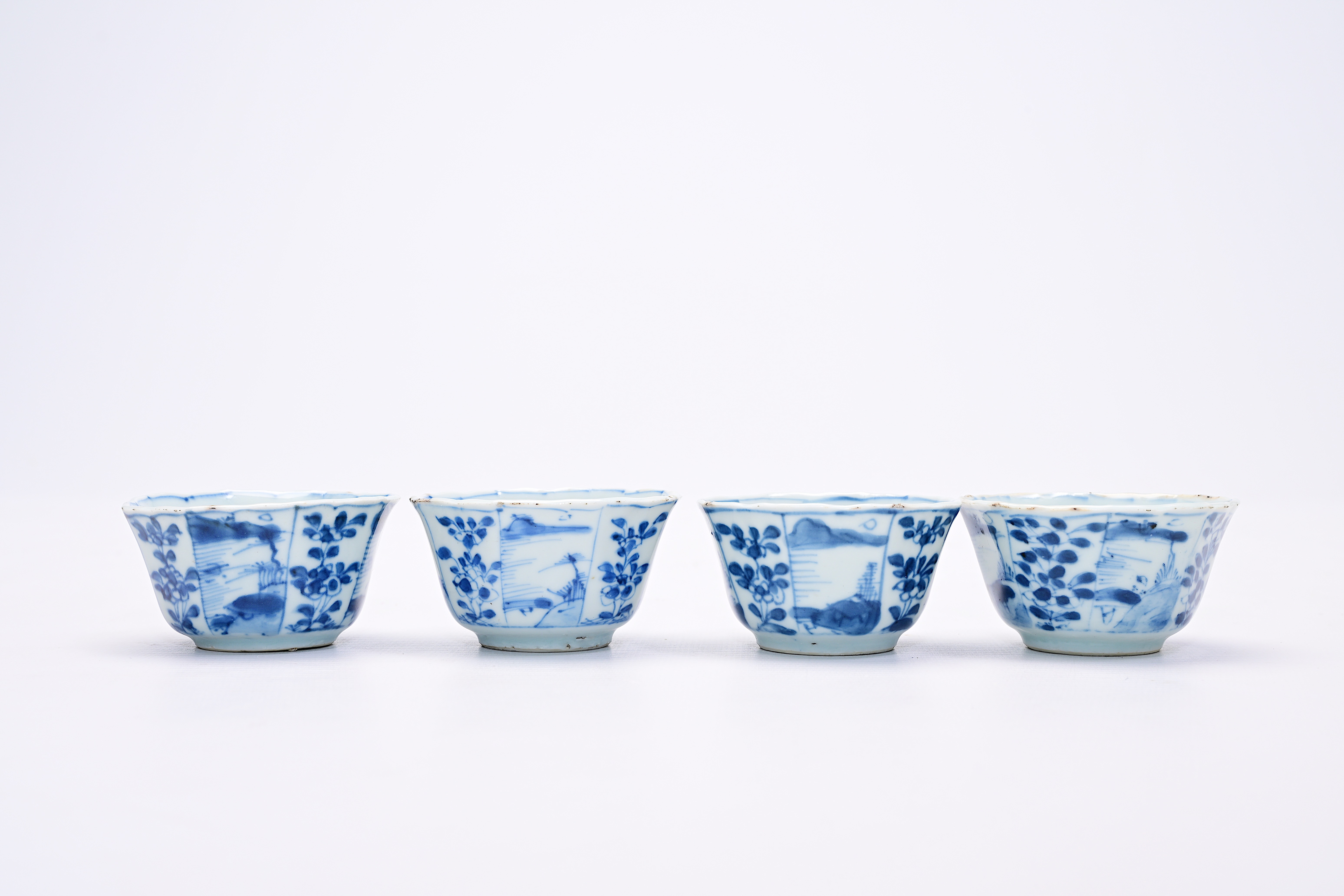 Four Chinese blue and white cups and saucers with floral design and landscapes, Kangxi - Image 5 of 12