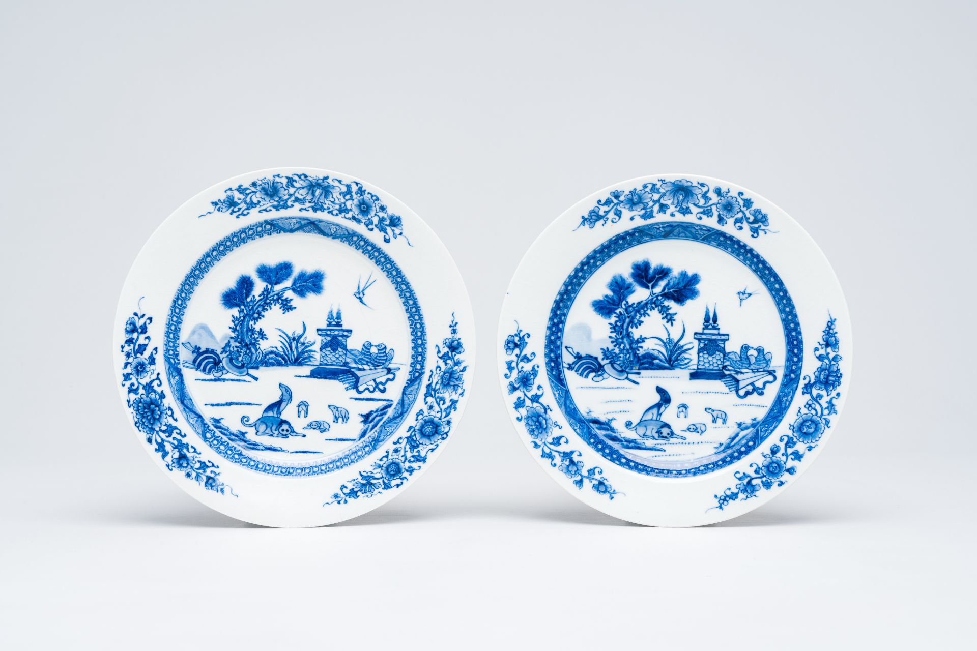 A pair of Chinese blue and white soft paste 'dogs and pigeons' plates, Qianlong - Image 2 of 3