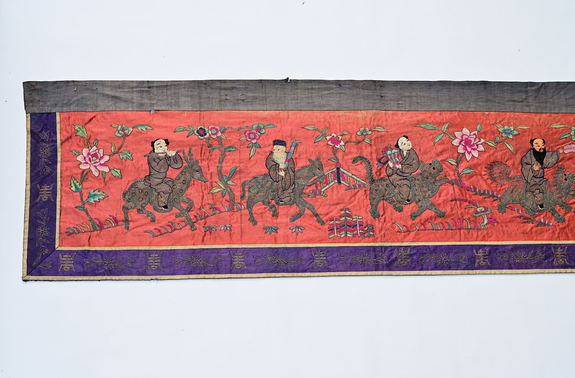 A long Chinese horizontal silk embroidered 'Eight Immortals' altar cloth with silver thread, 19th C. - Image 3 of 13