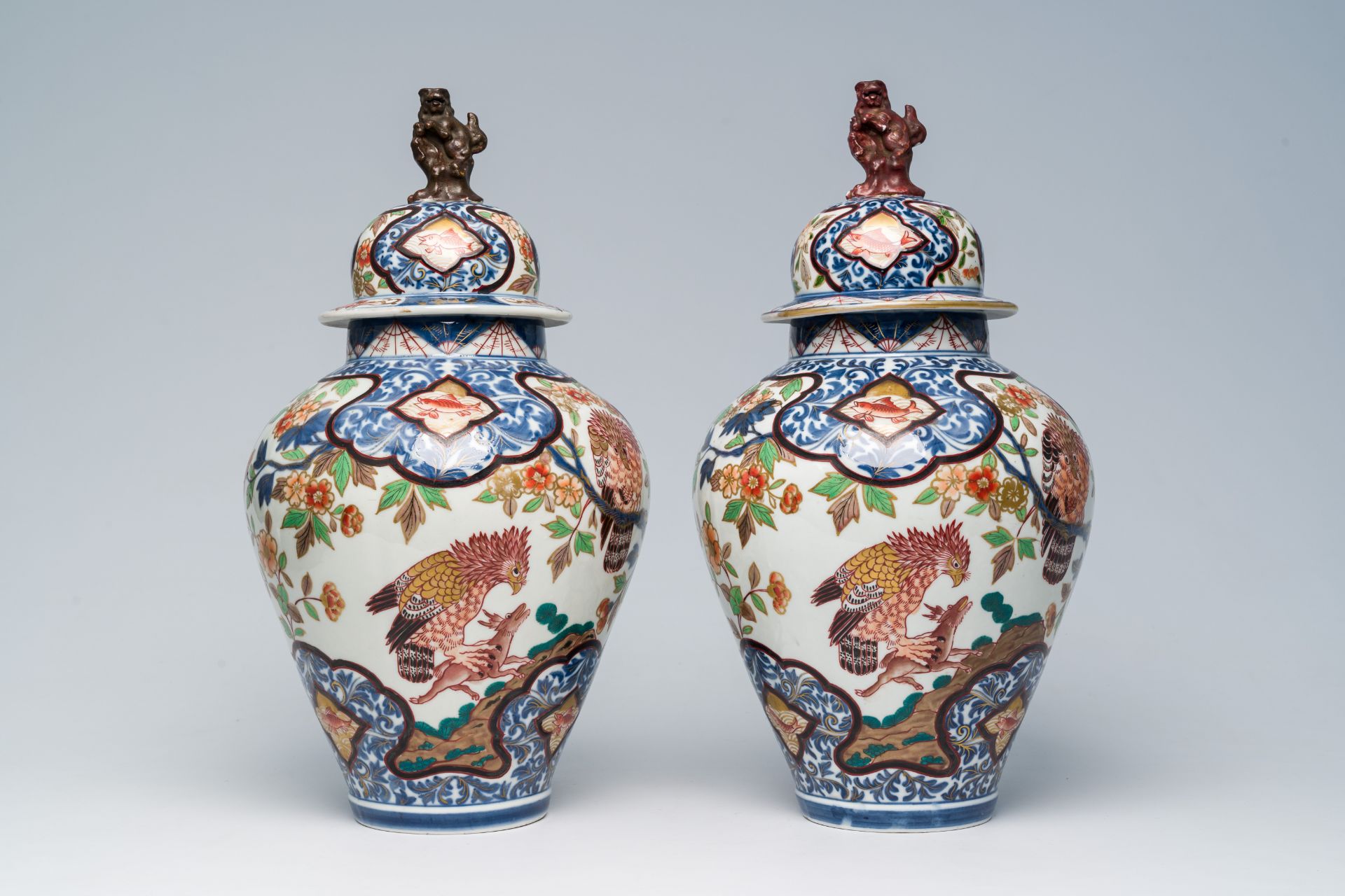 A pair of French Samson Imari style 'hunting eagles' vases and covers, Paris, 19th C.