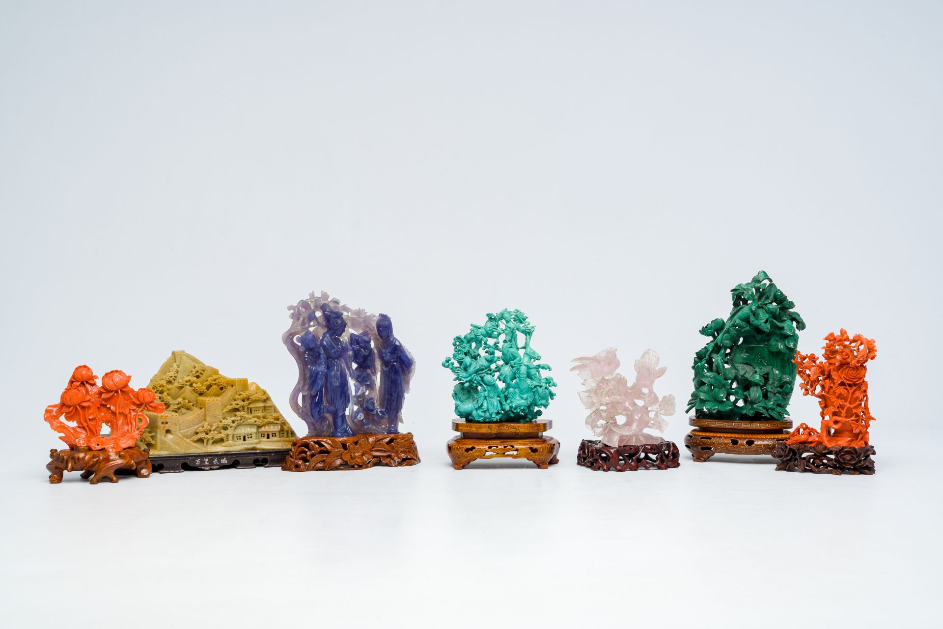 Seven various Chinese sculptures in red coral, lapis lazuli, malachite, quartz and soapstone, 19th/2