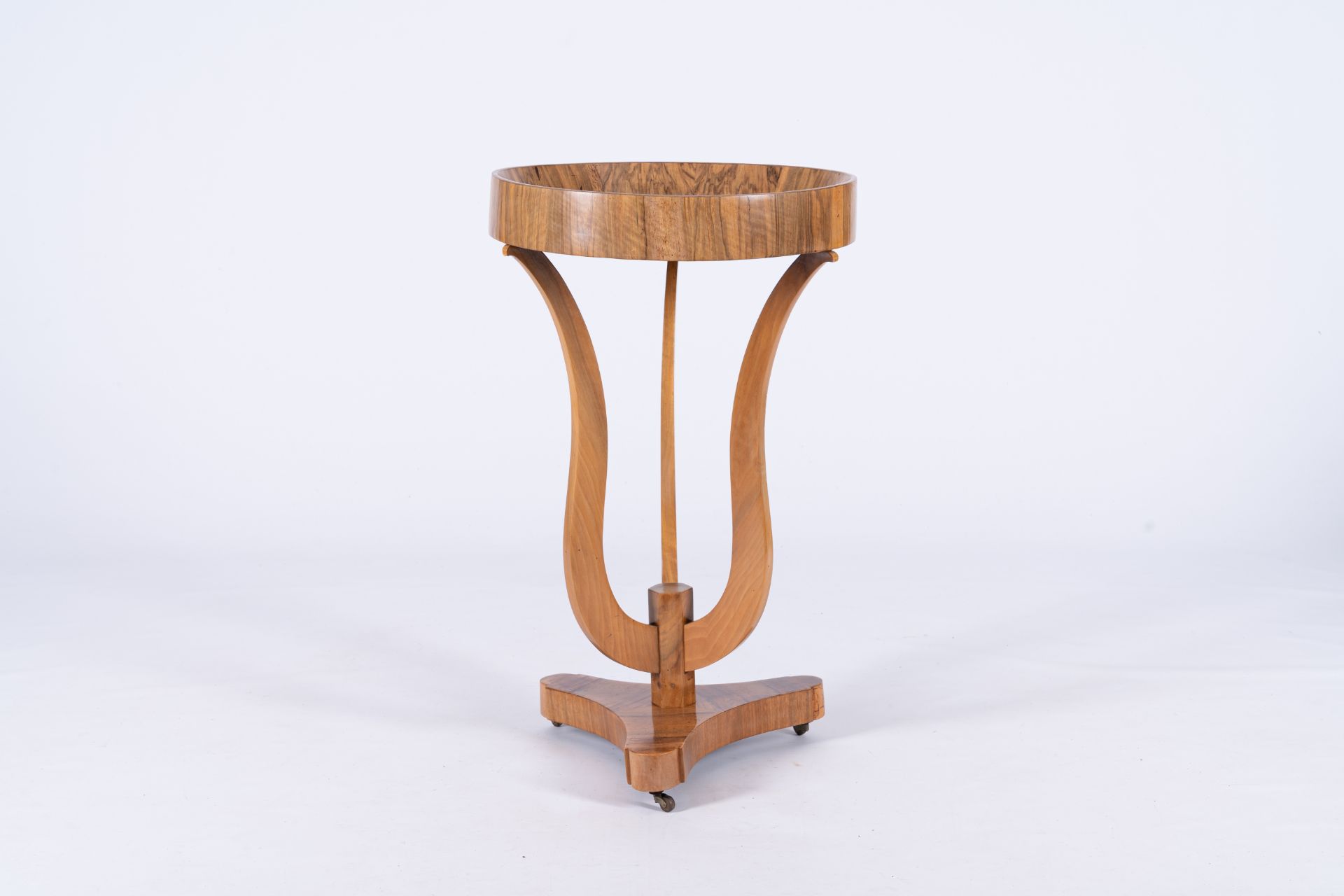 A round wood Art Deco side table or gueridon, 20th C.