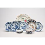 A varied collection of Chinese famille rose, blue, white and Imari style porcelain with landscapes a