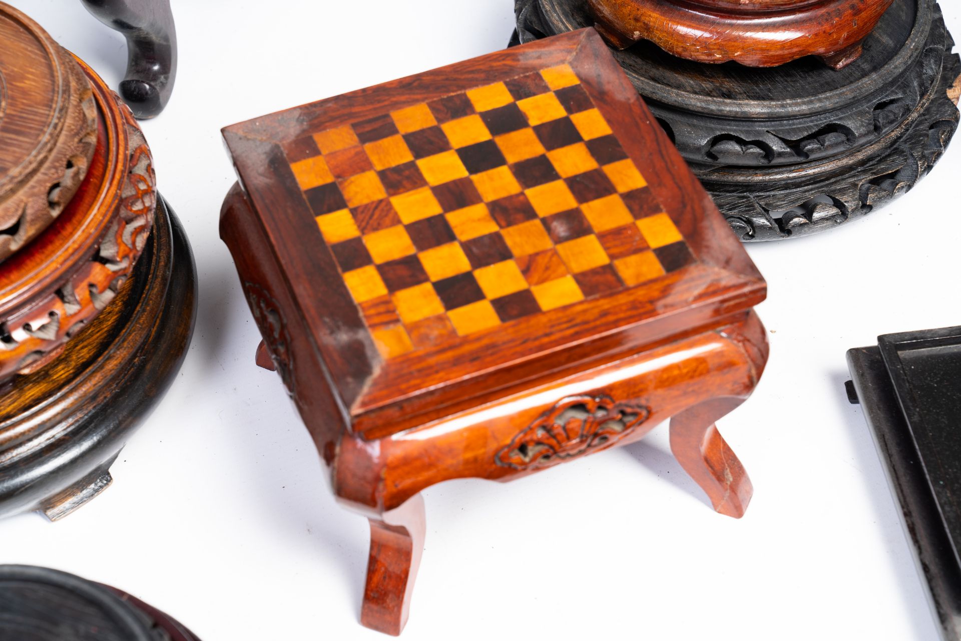 A varied collection of Chinese carved wood stands, 19th/20th C. - Image 3 of 3