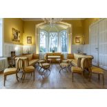 A 13-piece Biedermeier salon set comprising 3 sofas, 8 chairs and 2 footstools with yellow silk upho