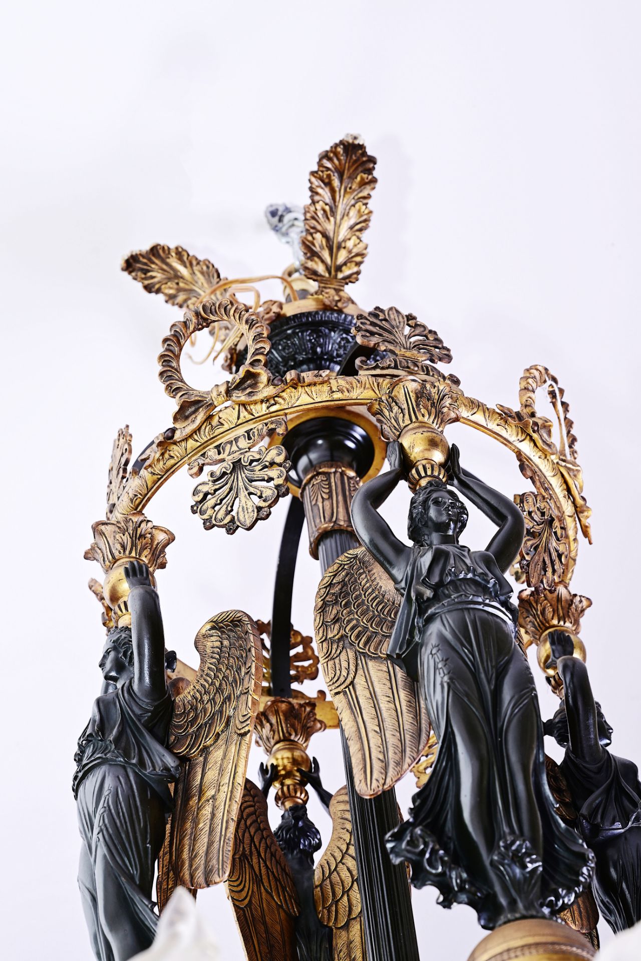 A French patinated and gilt bronze Empire style twelve-light 'caryatids' chandelier, 19th C. - Image 6 of 7