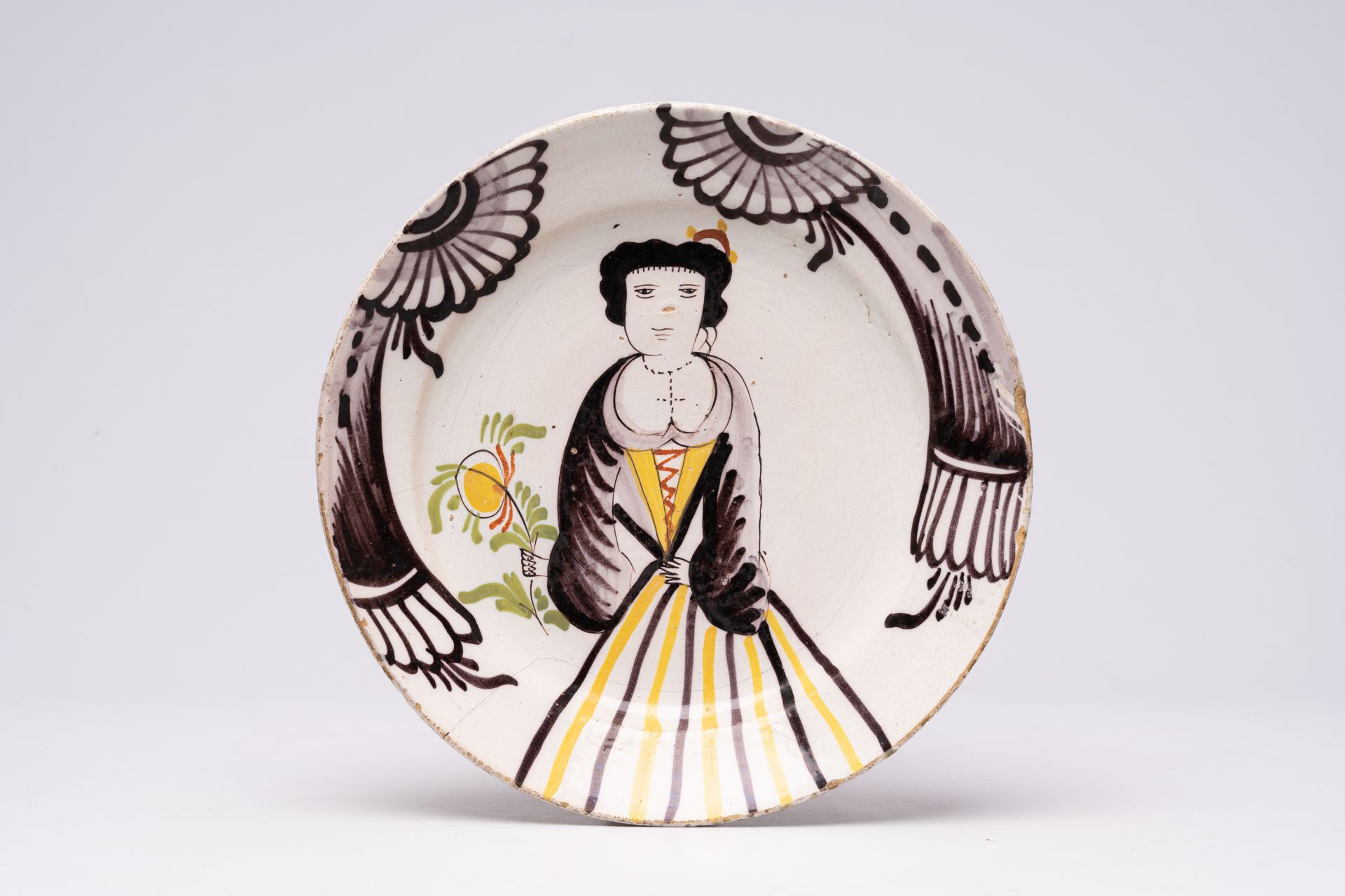 A polychrome French pottery dish with an allegory of smell, Desvres or Hesdin, 18th C.