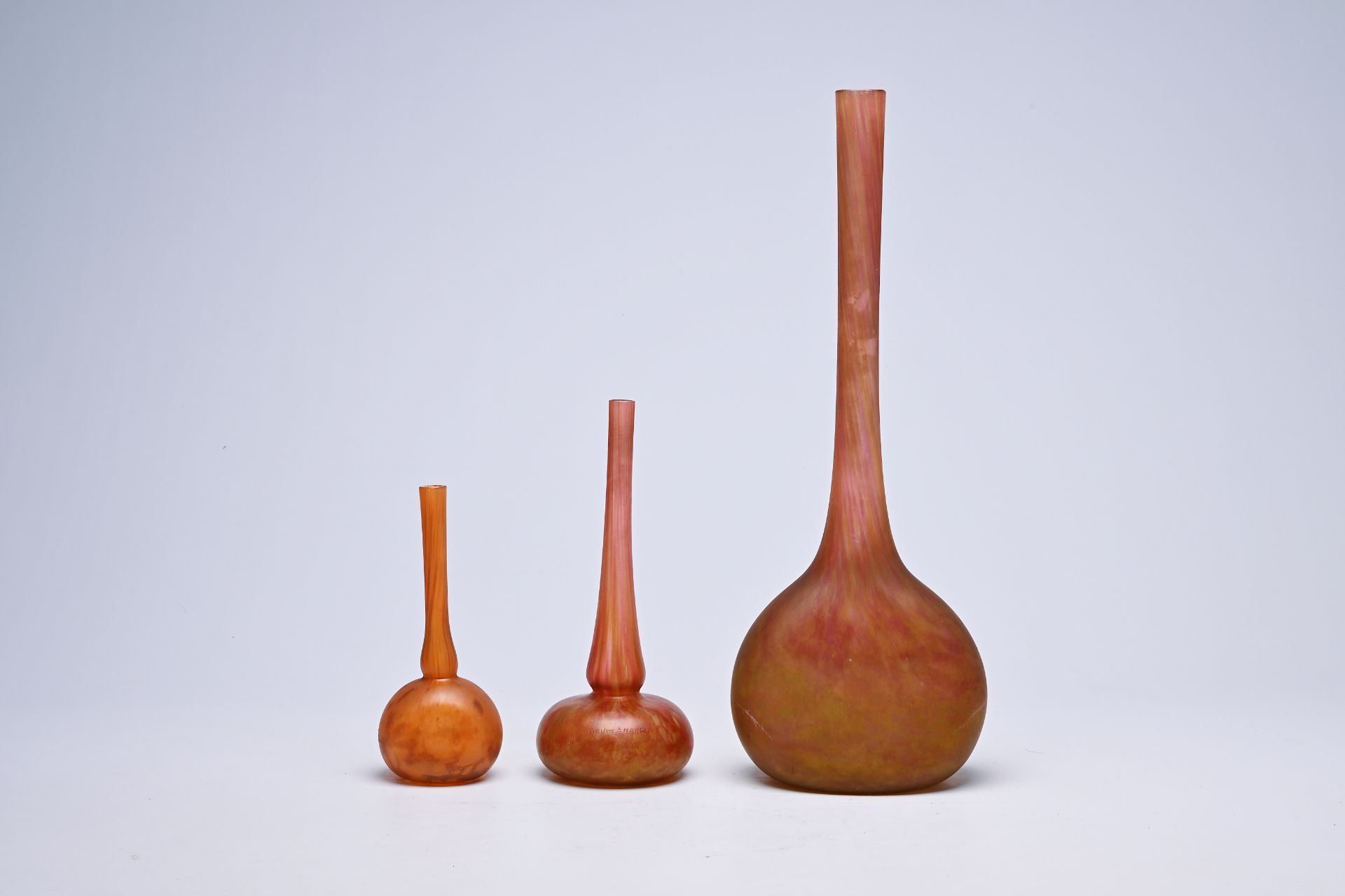 Three French solifleur vases, marked 'Daum Nancy France', 20th C.