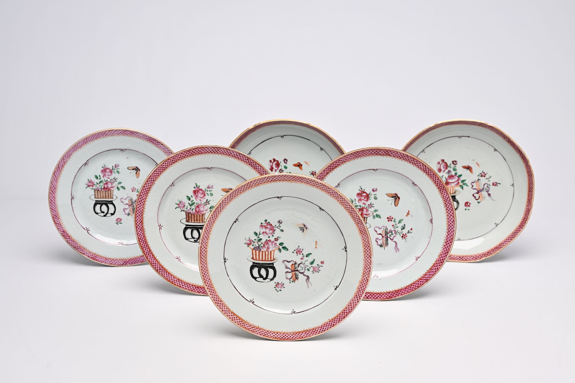 Six Chinese famille rose plates with antiquities and floral design, Qianlong