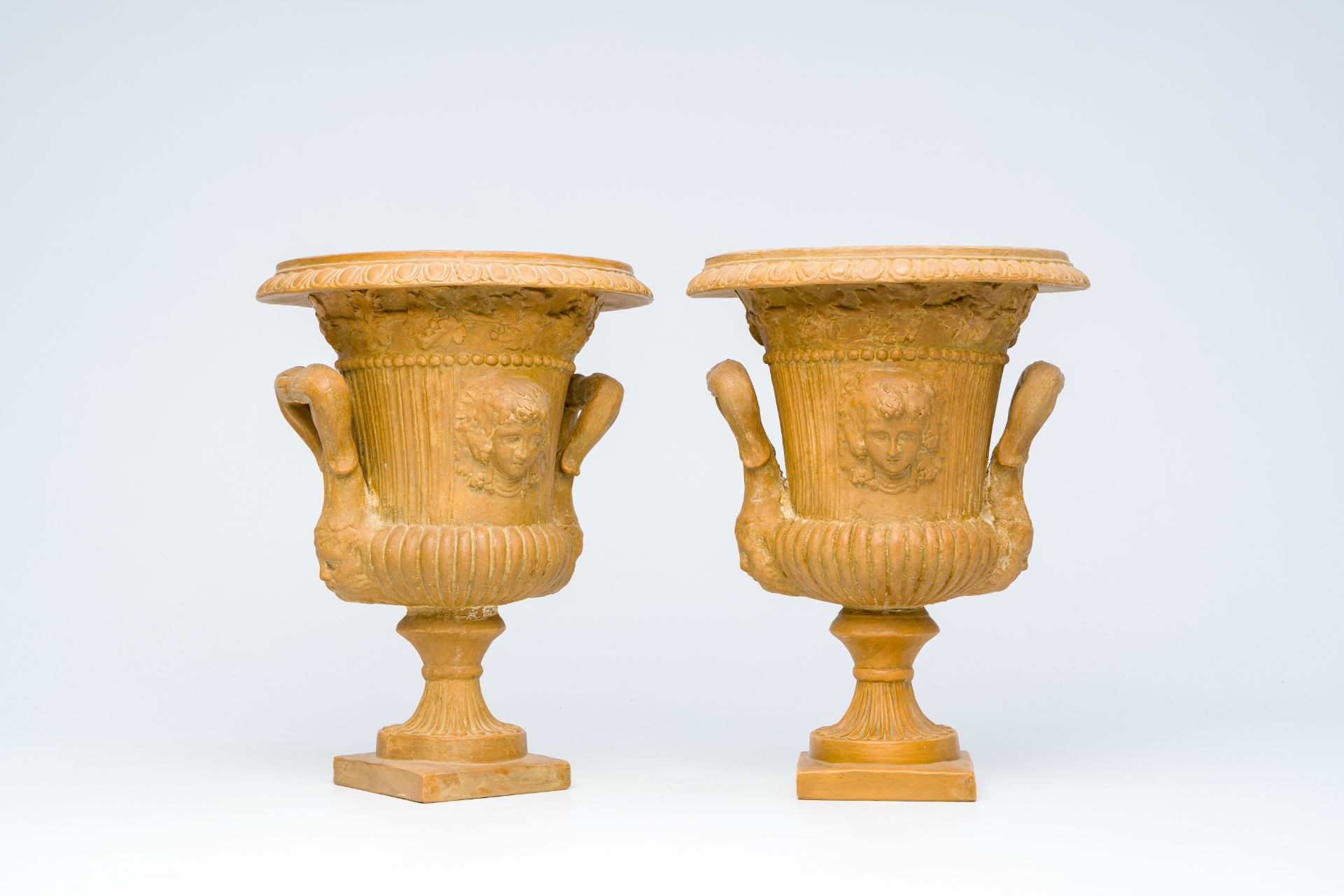 A pair of French terracotta 'Medici' vases, 19th/20th C.