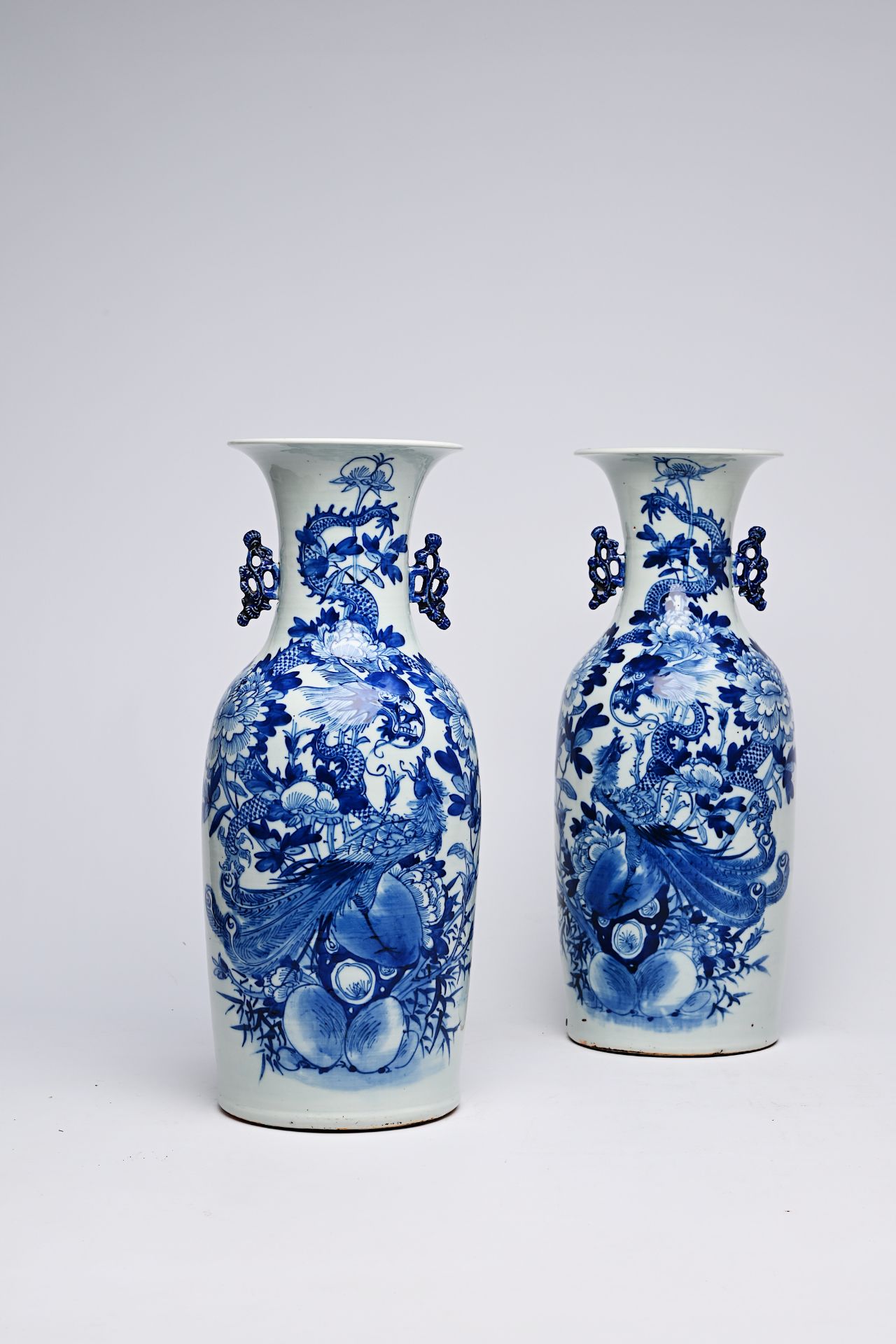 A pair of Chinese blue and white celadon ground vases with a dragon and a phoenix among blossoming b - Bild 23 aus 28