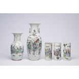 Five Chinese famille rose and qianjiang cai vases and hat stands with figurative design, 19th/20th C