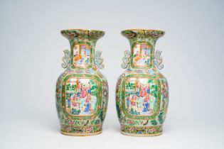 A pair of Chinese Canton famille rose celadon ground vases with palace scenes, animals and antiquiti