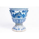 A large French blue and white earthenware Louis XIV vase on stand with oriental landscapes and masca