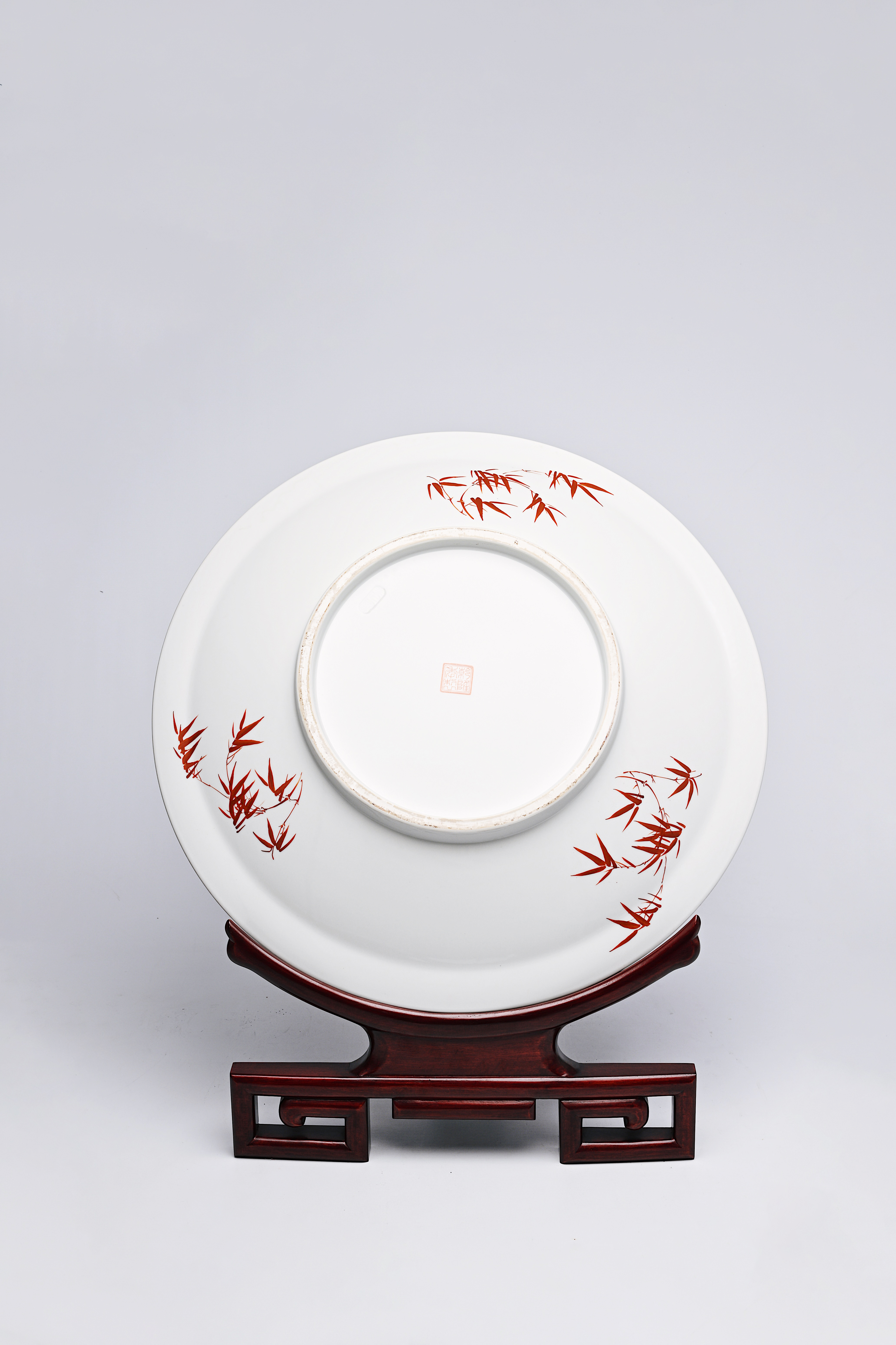 A large Chinese famille rose dish with ladies and children in a landscape, Qianlong mark, 20th C. - Image 8 of 16