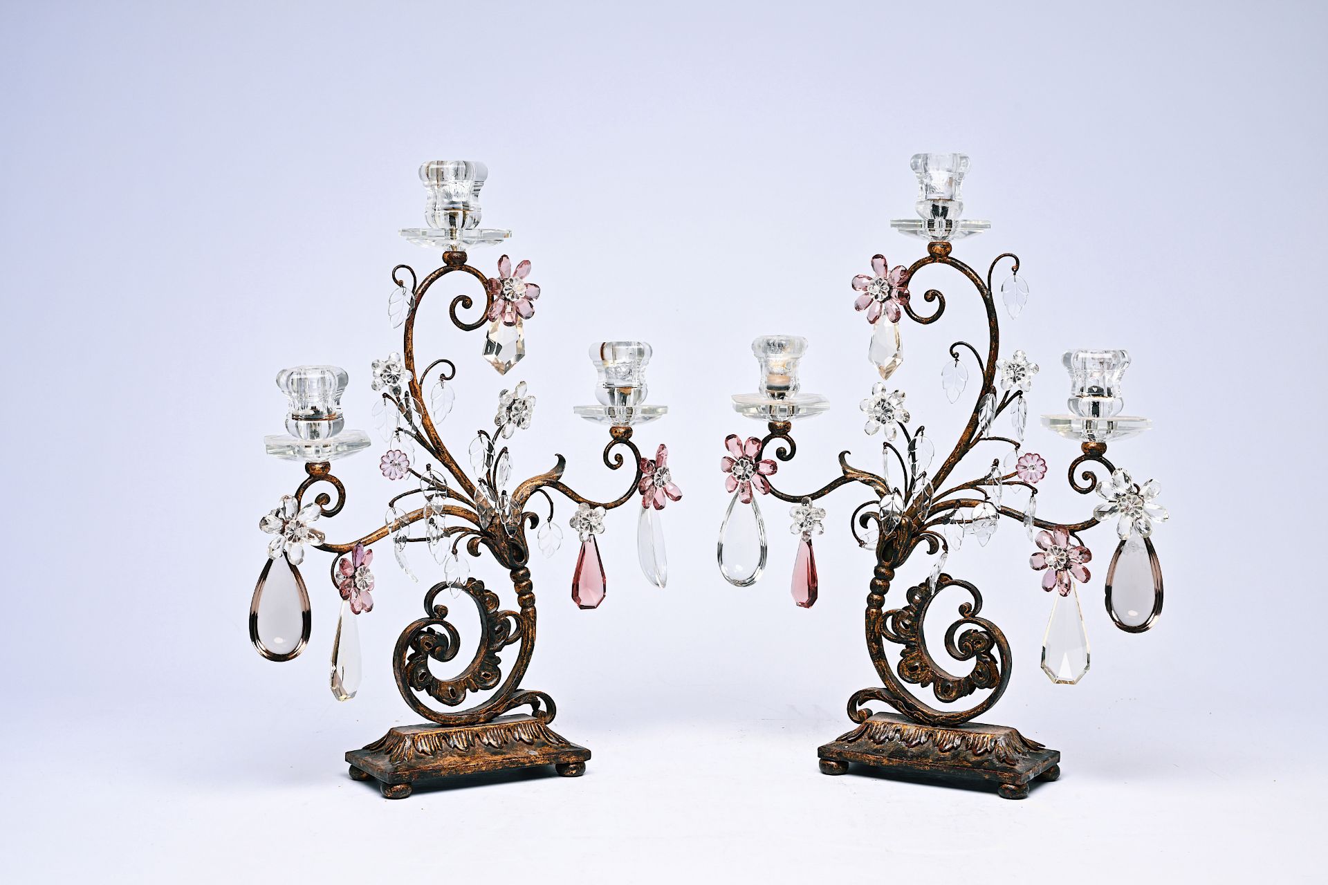 A pair of French gilt metal S-shaped candelabra with cut amethyst and amber crystal by Baccarat, pro