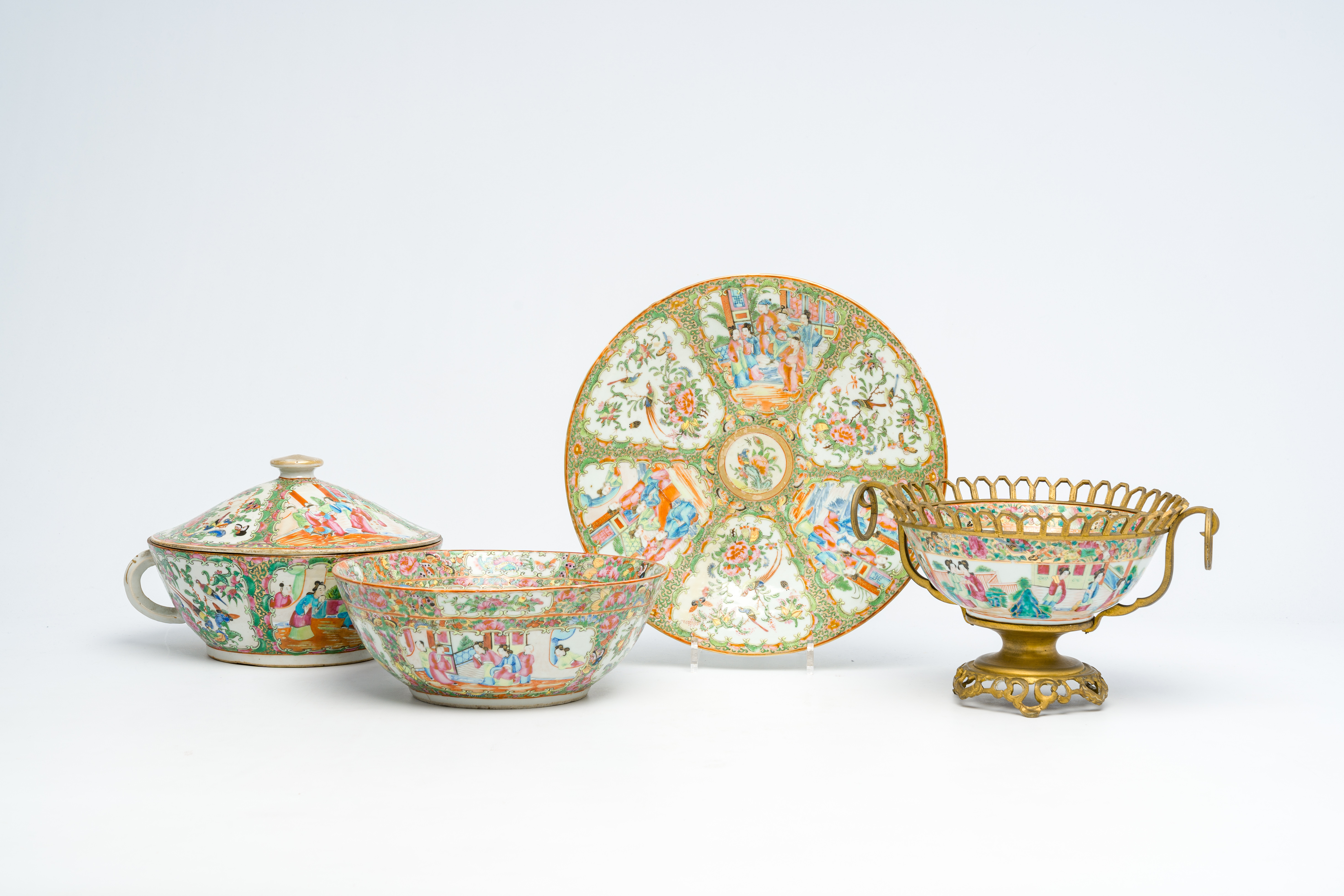 A varied collection of Chinese Canton famille rose porcelain with palace scenes and floral design, 1