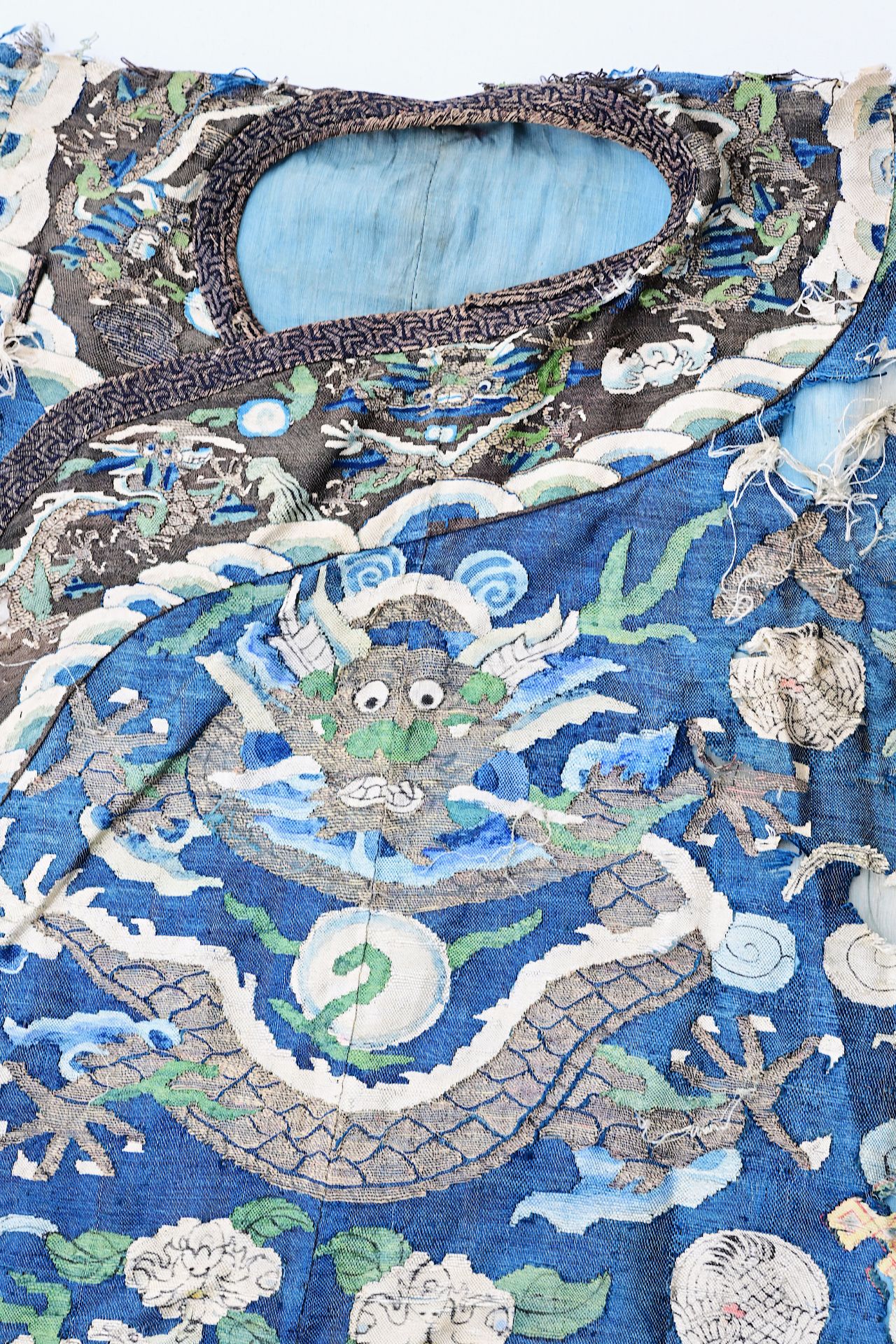 A Chinese embroidered silk 'dragons chasing the pearl' robe, 19th C. - Image 8 of 9