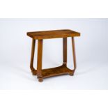 A French Art Deco walnut veneered side table, second quarter 20th C.