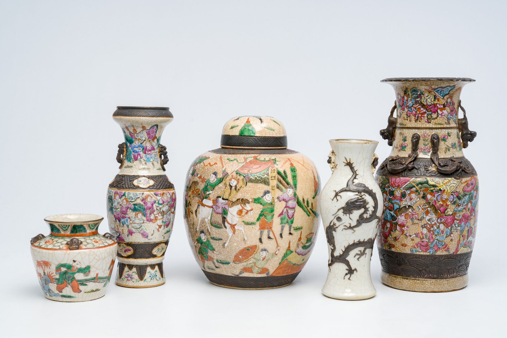 Five Chinese Nanking crackle glazed famille rose and verte vases with dragons, warrior scenes and pl