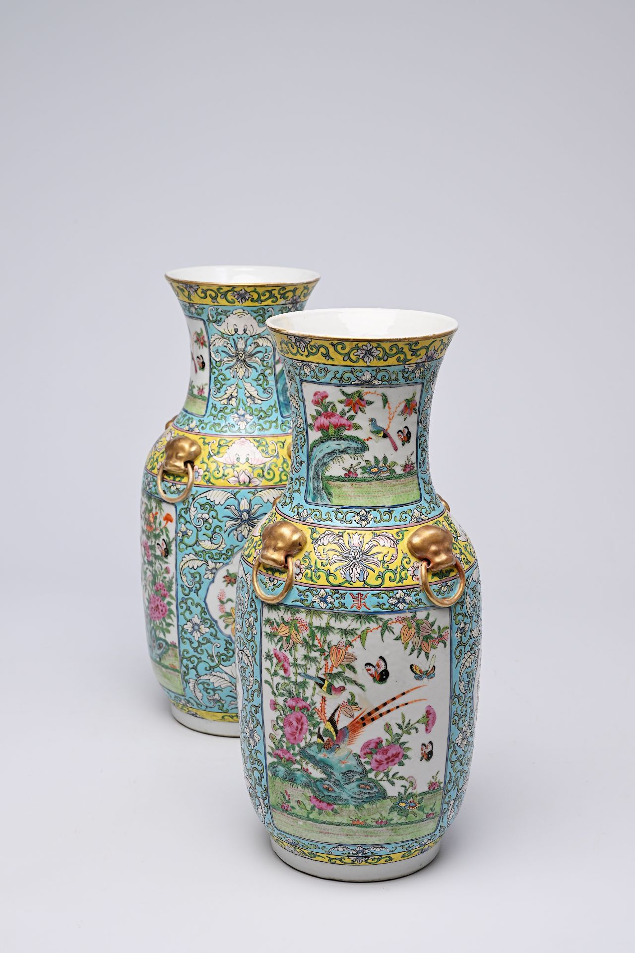 A pair of Chinese Canton famille rose turquoise ground vases with birds and butterflies among blosso - Bild 13 aus 13