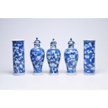 A Chinese blue and white prunus on cracked ice ground five-piece garniture, Kangxi mark, 19th C.