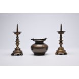 A pair of Italian bronze candlesticks and a holy water bucket, 16th/17th C.