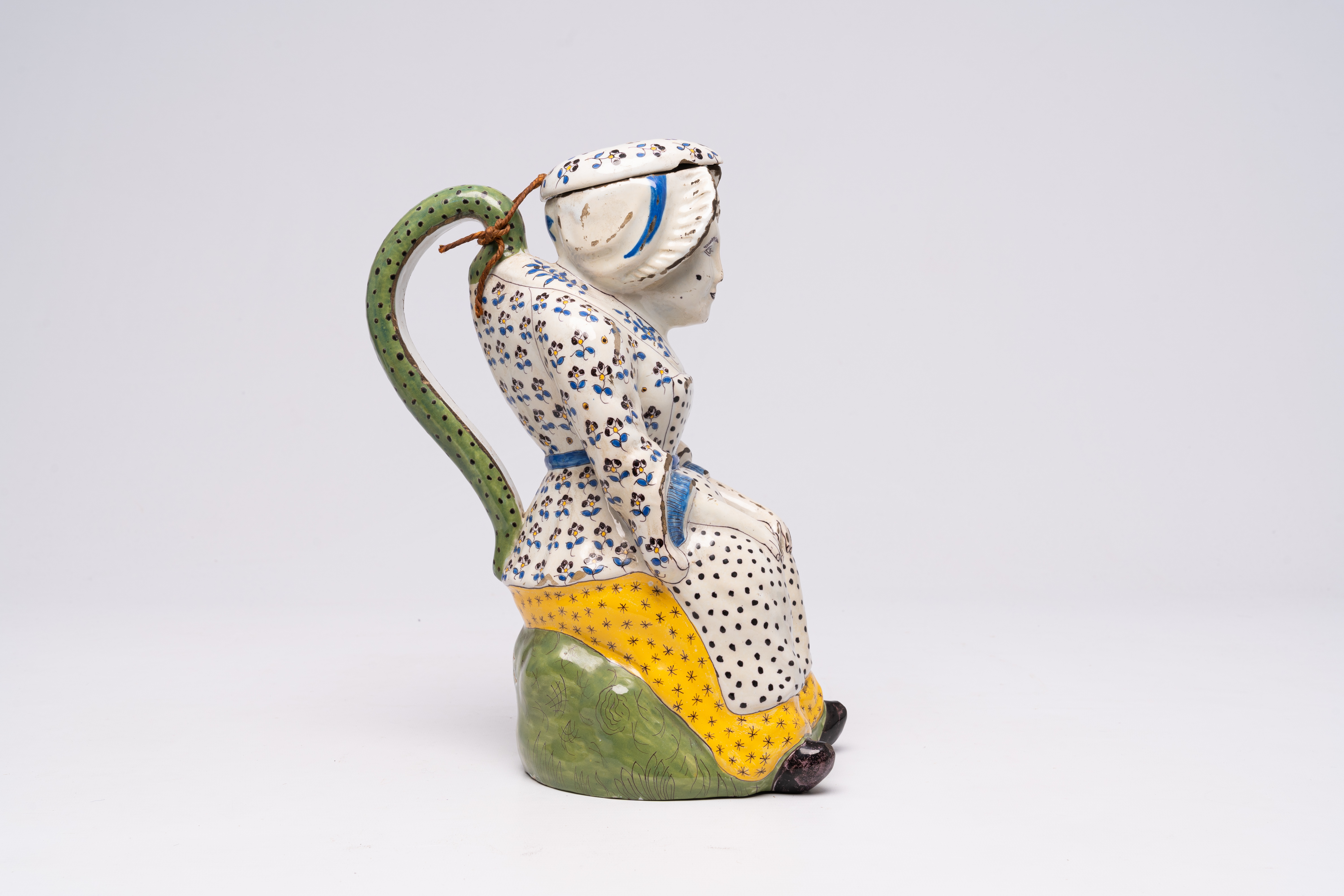 A large polychrome French faience 'Jacqueline' jug in the style of Lille, Desvres, 19th C. - Image 6 of 8