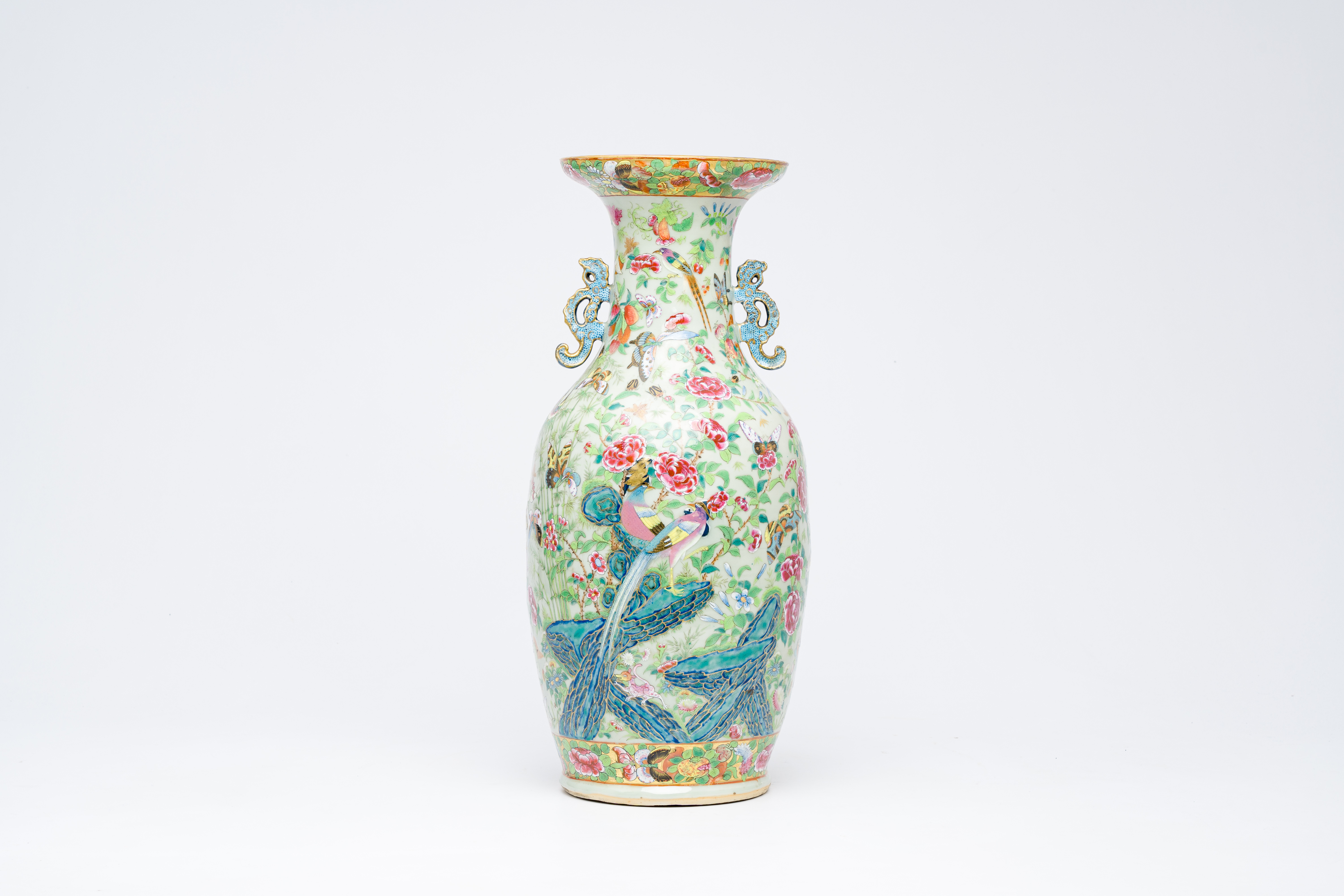 A Chinese Canton famille rose celadon ground vase with animals and figures among flowering branches,