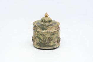 A bronze pyxis with engraved design, Middle East, possibly 11th C.