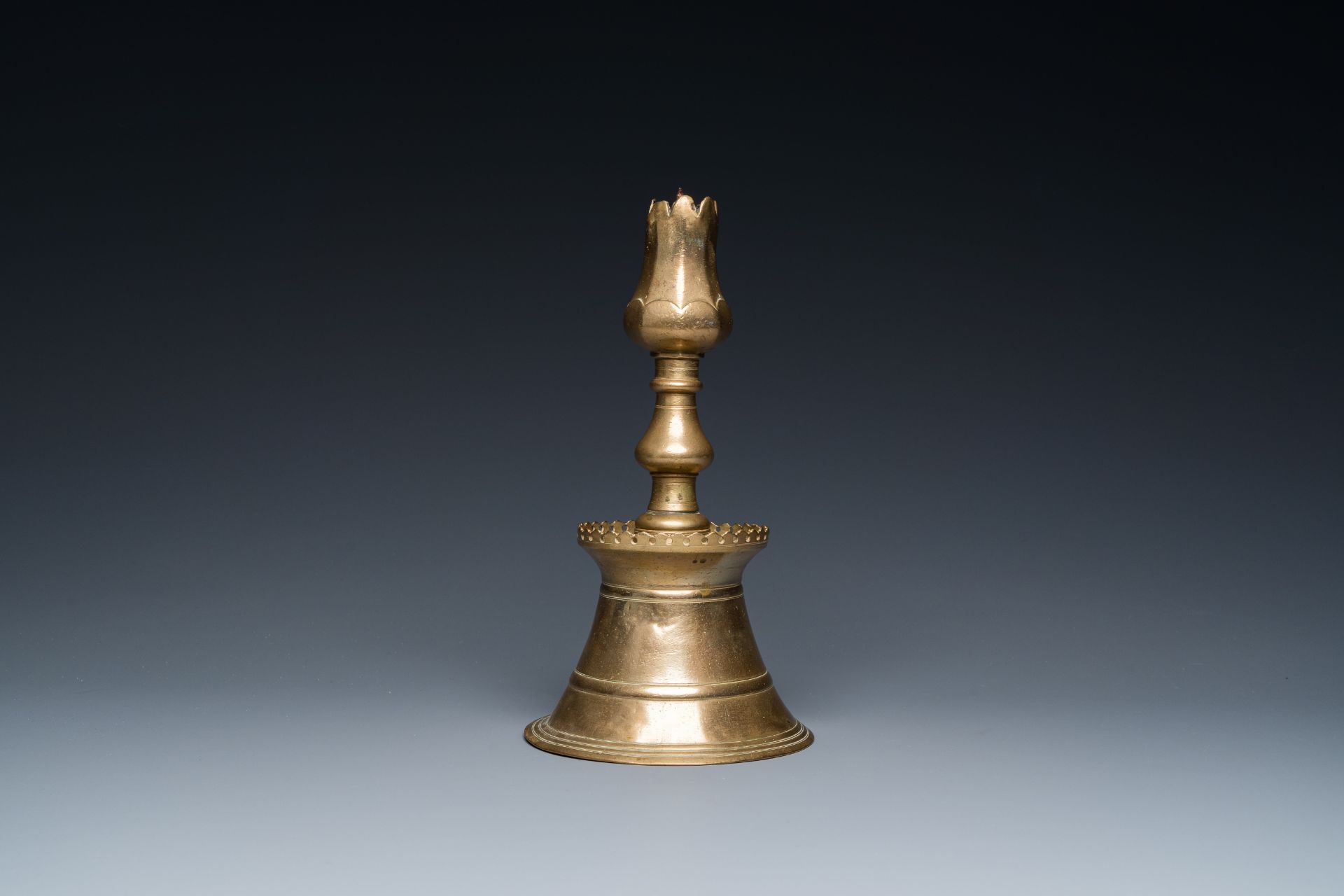 A Turkish bronze candlestick with tulip-shaped sconce, 18th C.