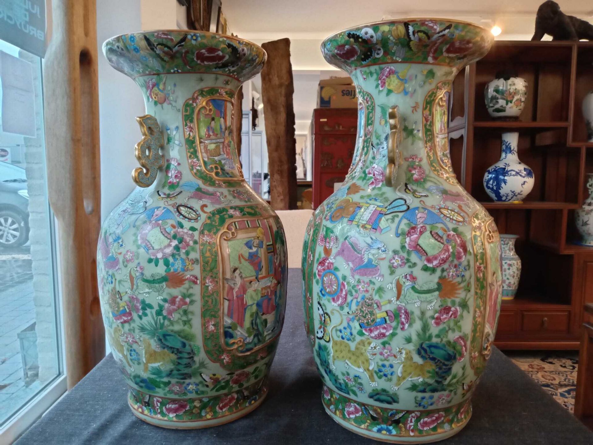 A pair of Chinese Canton famille rose celadon ground vases with palace scenes, animals and antiquiti - Image 17 of 64