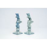 A pair of blue and white Italian pottery 'griffin' candlesticks, Cantagalli, late 19th C.