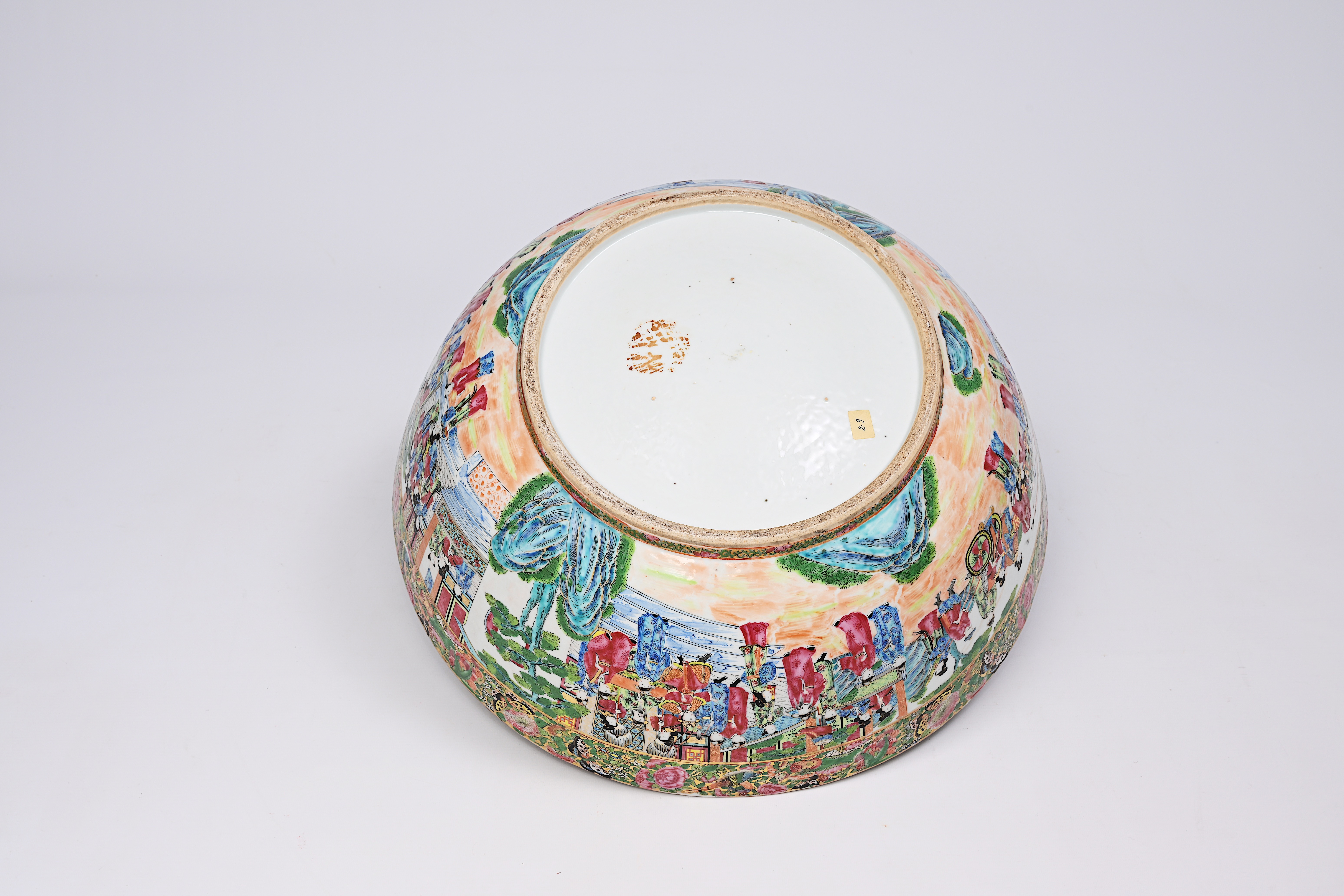 A large Chinese Canton famille rose bowl with floral design and palace scenes, 19th C. - Image 8 of 9