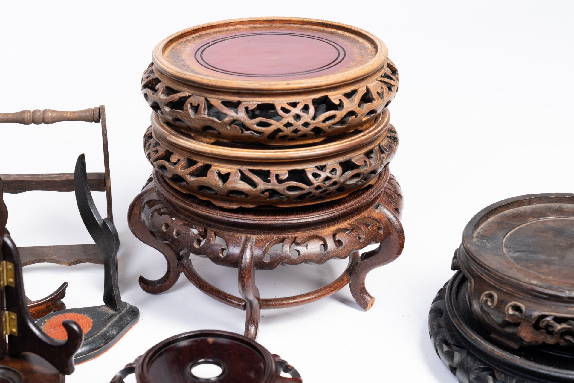 A varied collection of Chinese carved wood stands and covers, 19th/20th C. - Image 2 of 4