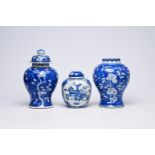Two Chinese blue and white prunus on cracked ice ground vases and a jar and cover with antiquities,