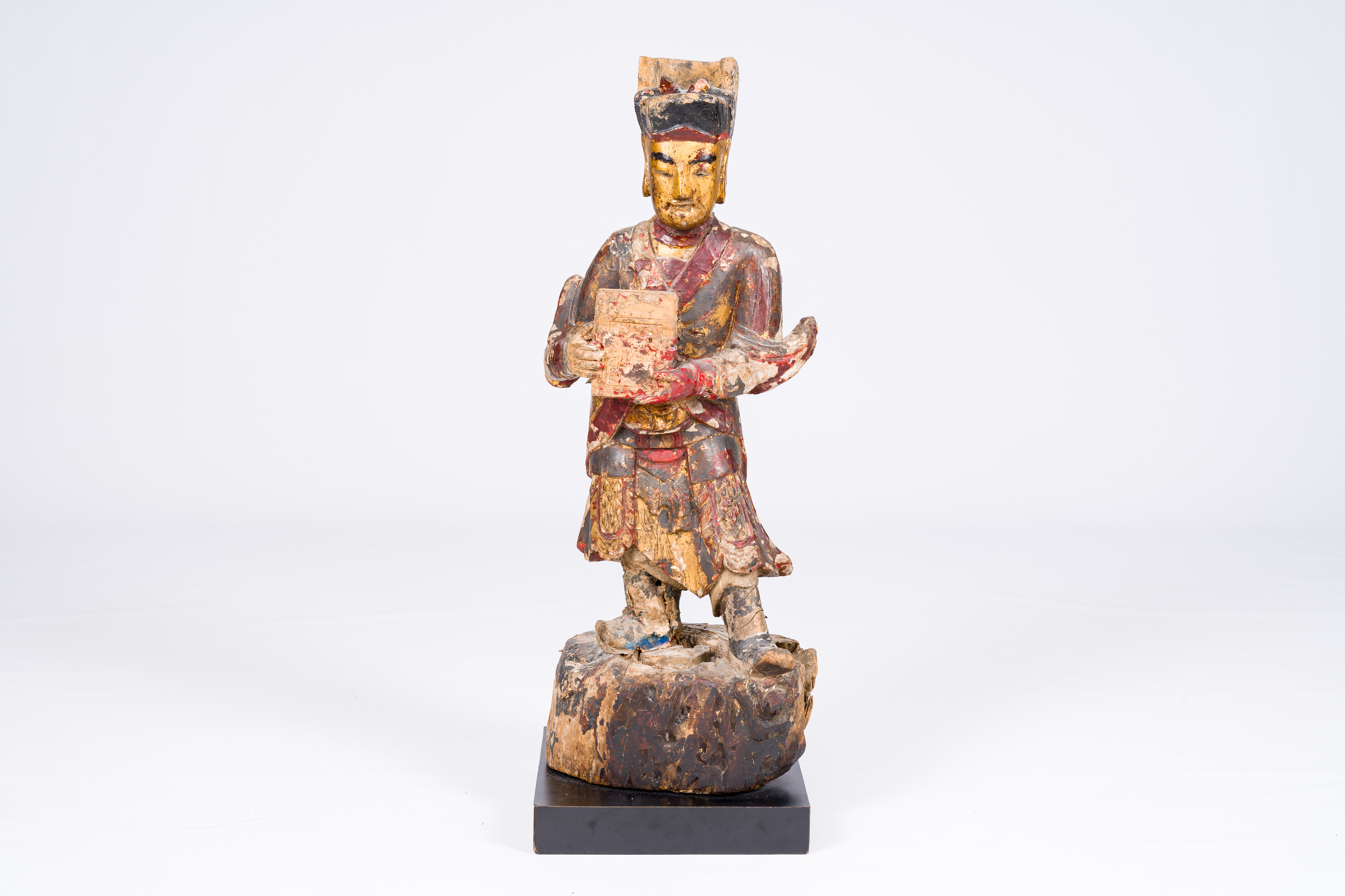 A Chinese gilt and polychromed wood sculpture of a guardian, Qing