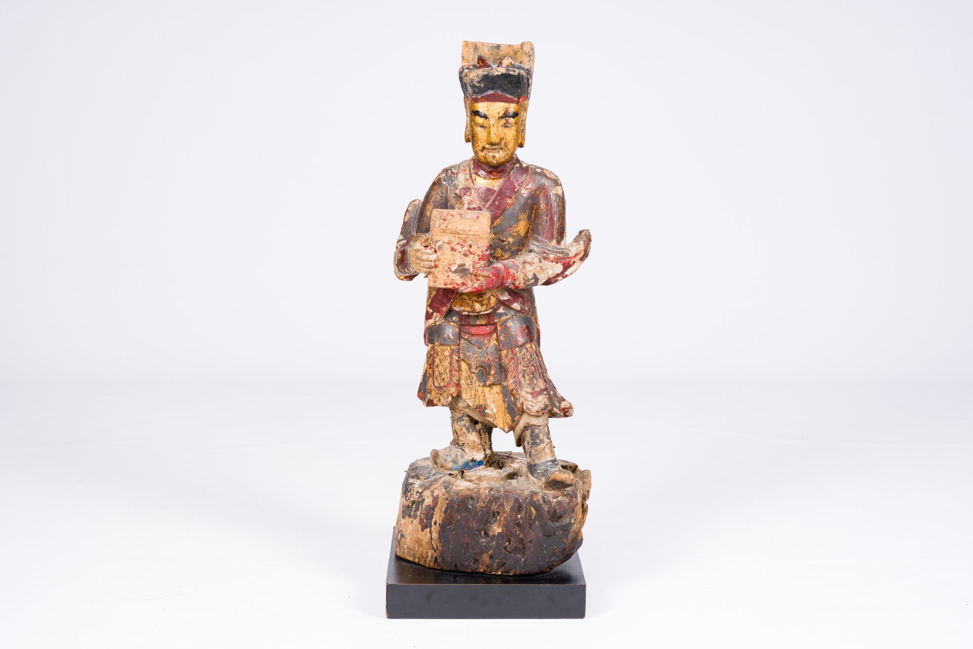 A Chinese gilt and polychromed wood sculpture of a guardian, Qing