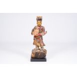 A Chinese gilt and polychromed wood sculpture of a guardian, Qing