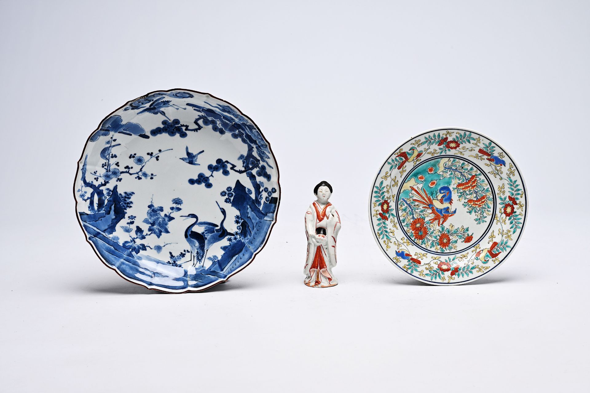 A Japanese blue and white and a Kakiemon plate with birds in a landscape and a 'bijin' figure, Edo/M - Image 2 of 5