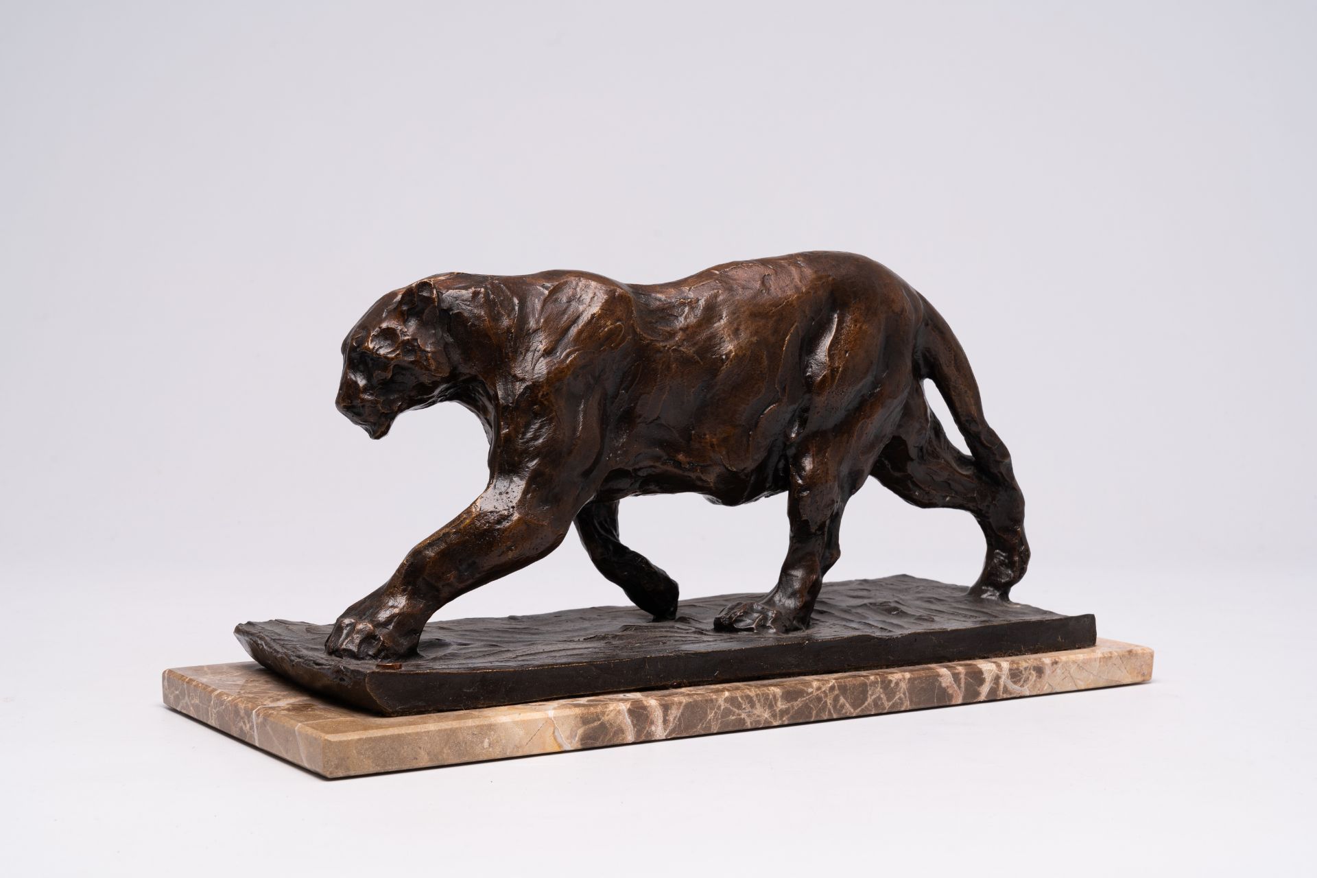Rembrandt Bugatti (1884-1916, after): 'Panthere marchant', brown patinated bronze on a marble base,