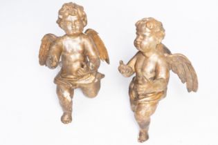 A pair of large gilded wood sculptures of angels, probably Flanders, first half 18th C.