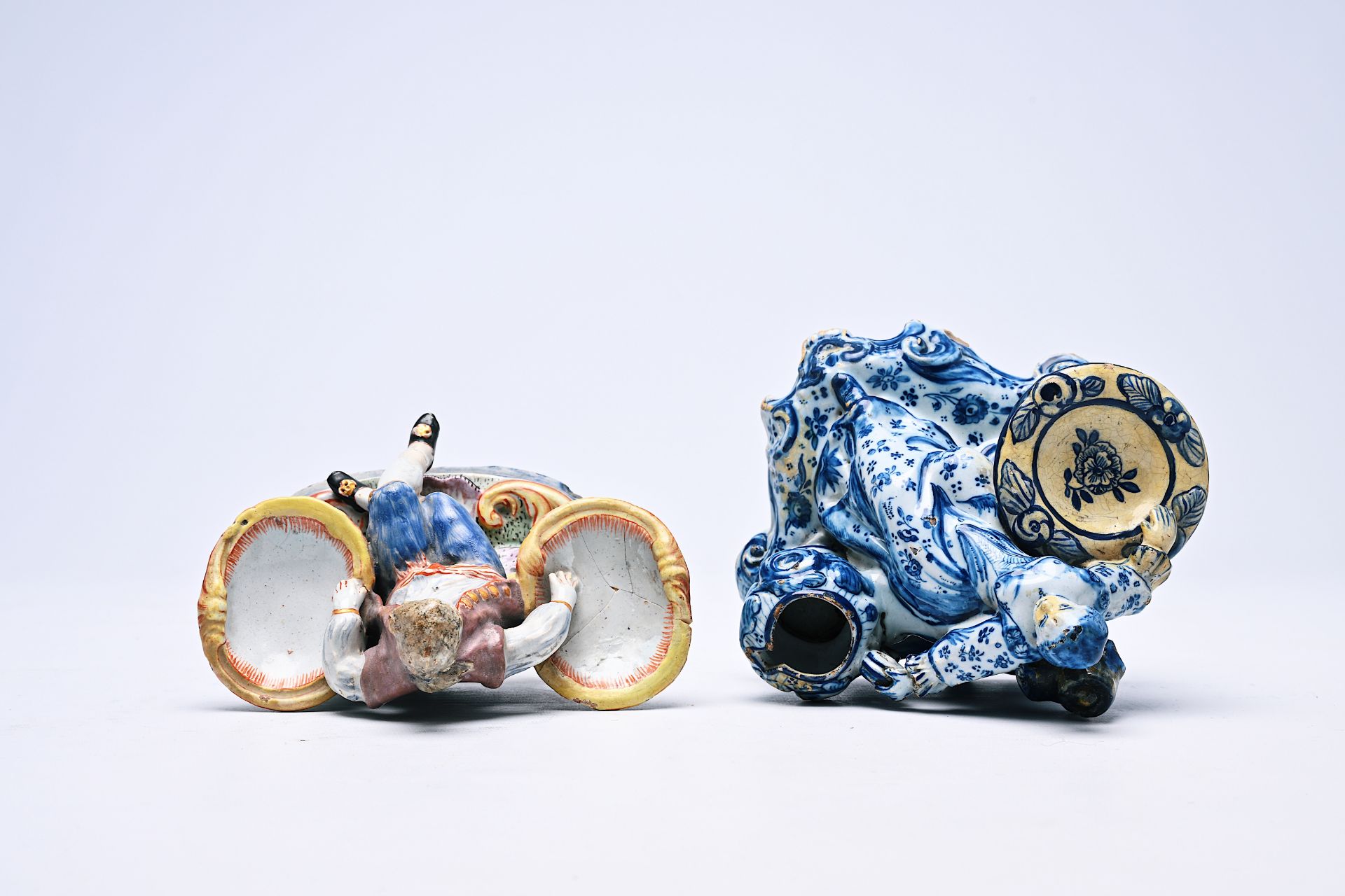 Two Dutch Delft blue and white and polychrome salts in the form of a man and a woman, 18th/19th C. - Image 4 of 6