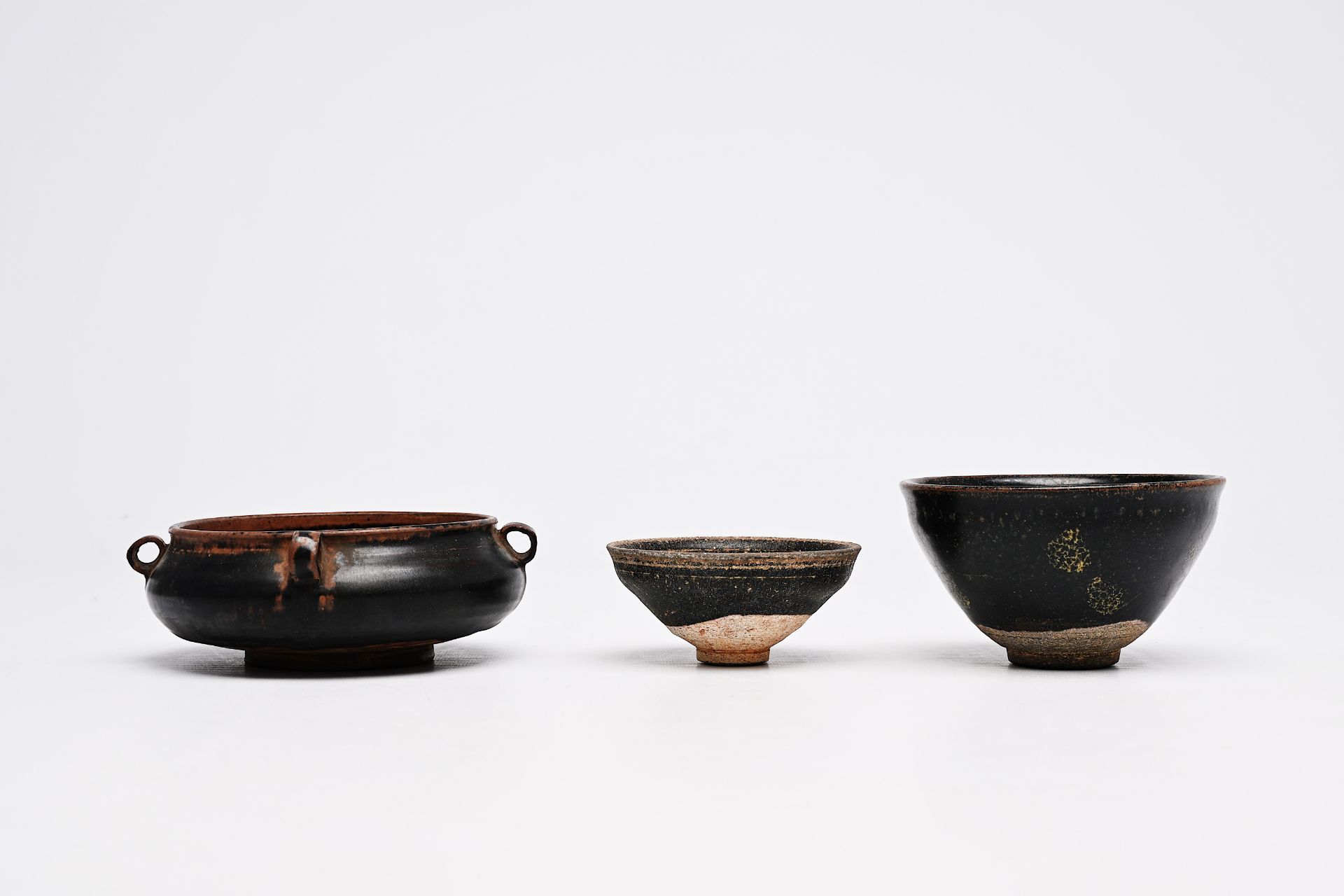 A Chinese black-glazed censer and two tea bowls, Song or later