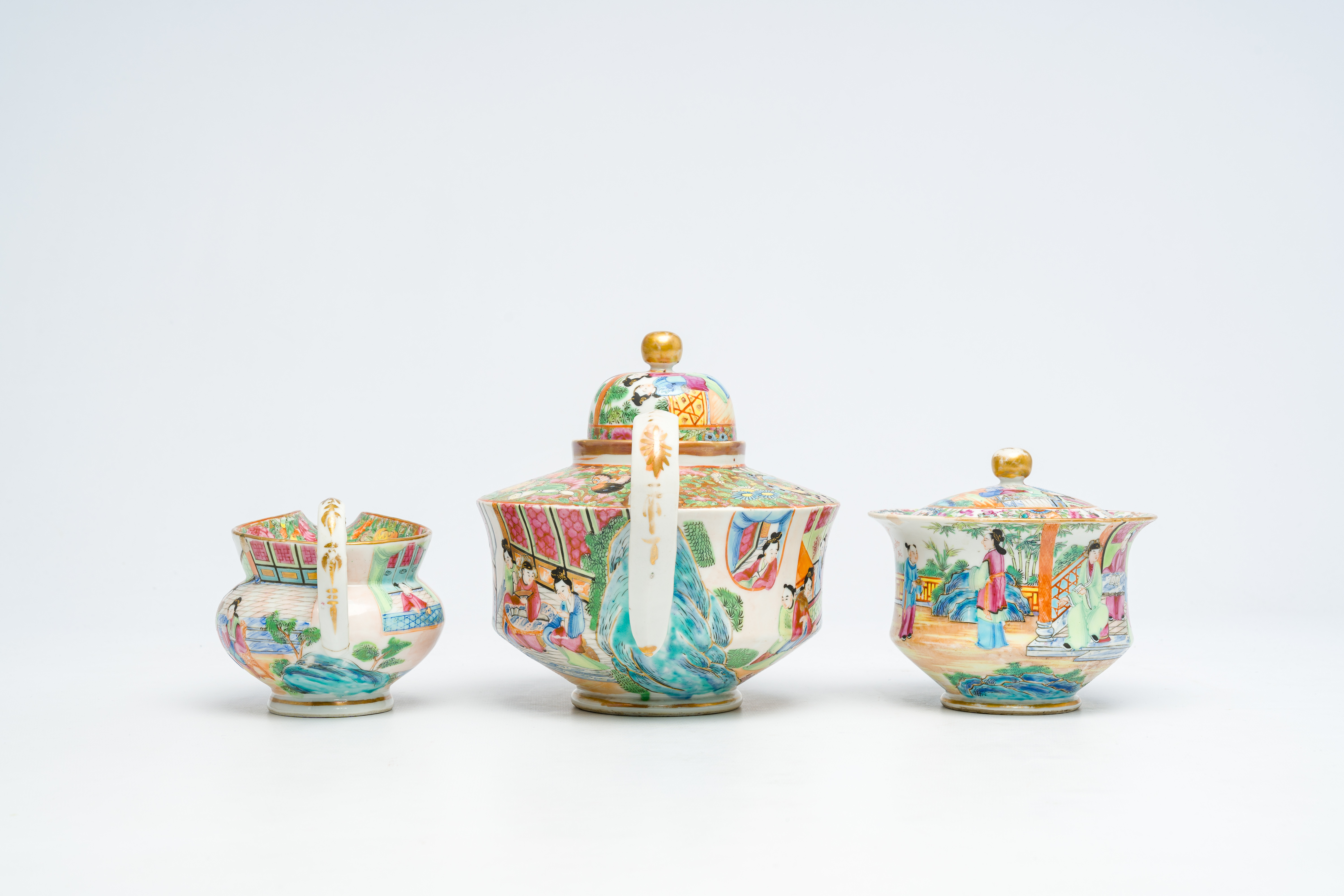 A Chinese Canton famille rose three-part tea set with palace scenes, 19th C. - Image 5 of 7