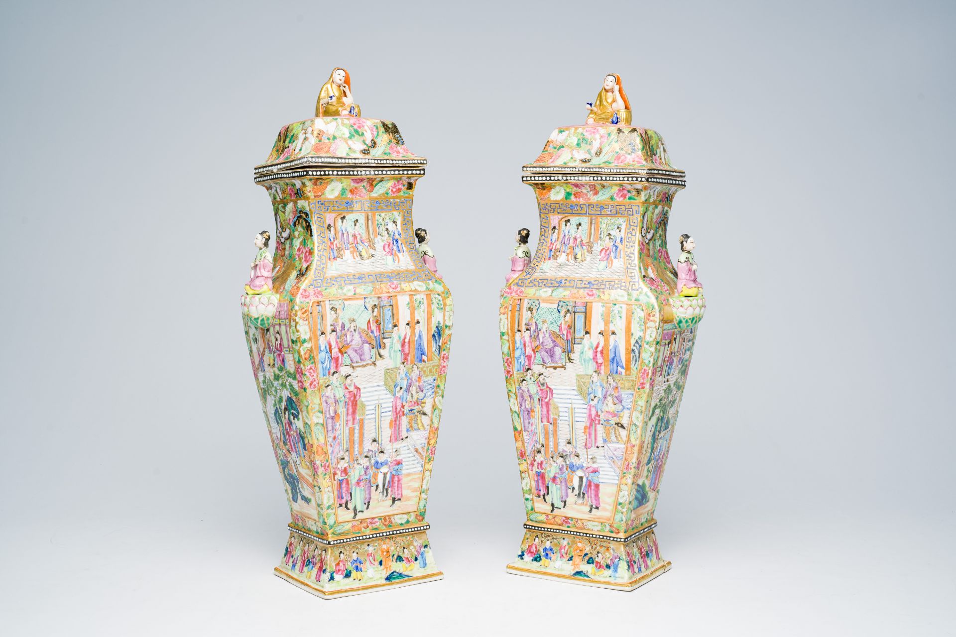 A pair of fine quadrangular Chinese Canton famille rose vases and covers with palace scenes and figu