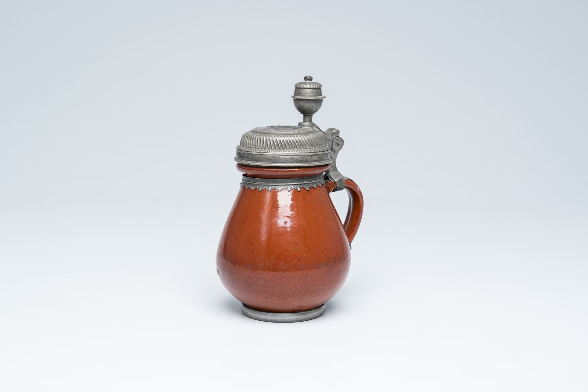 A German stoneware jug with pewter lid depicting the Adoration of the Shepherds, probably Altenburg,